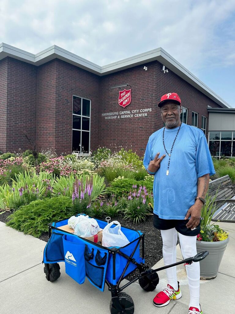 A man poses outside the Salvation Army